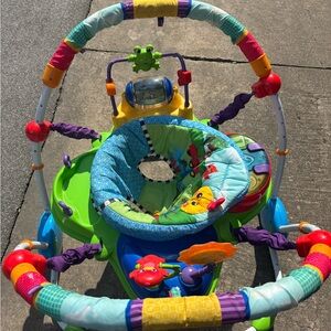 Fisher-Price Colorful Activity Jumper in Green, Blue, Purple and Red